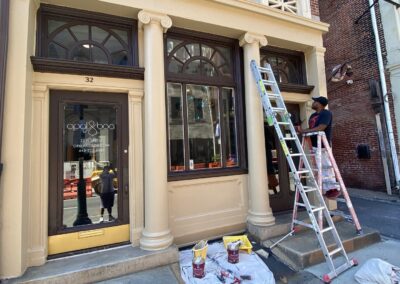 Exterior brick building Philadelphia with cream painted doors and trim