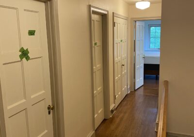 Interior hallway painting Philadelphia with cream walls and white ceiling