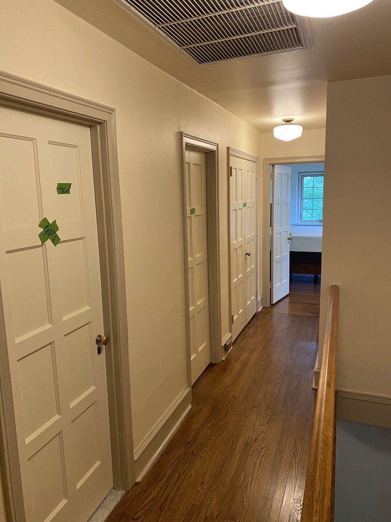 Freshly painted Philadelphia interior hallway with cream walls, white paneled doors, and detailed trim