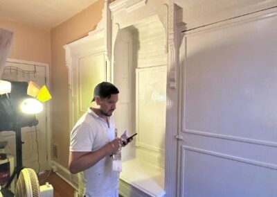 Philadelphia painter working on interior built-in cabinet trim painting
