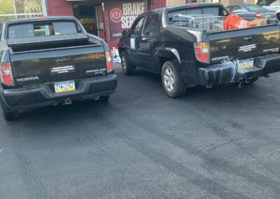 Painting company work trucks in a Philadelphia commercial area