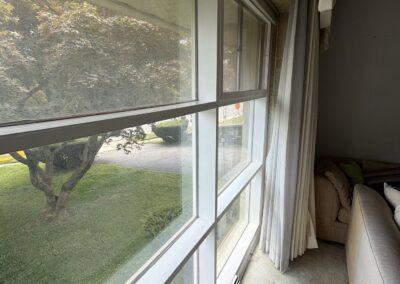 Living room window trim before professional interior painting in Philadelphia, PA