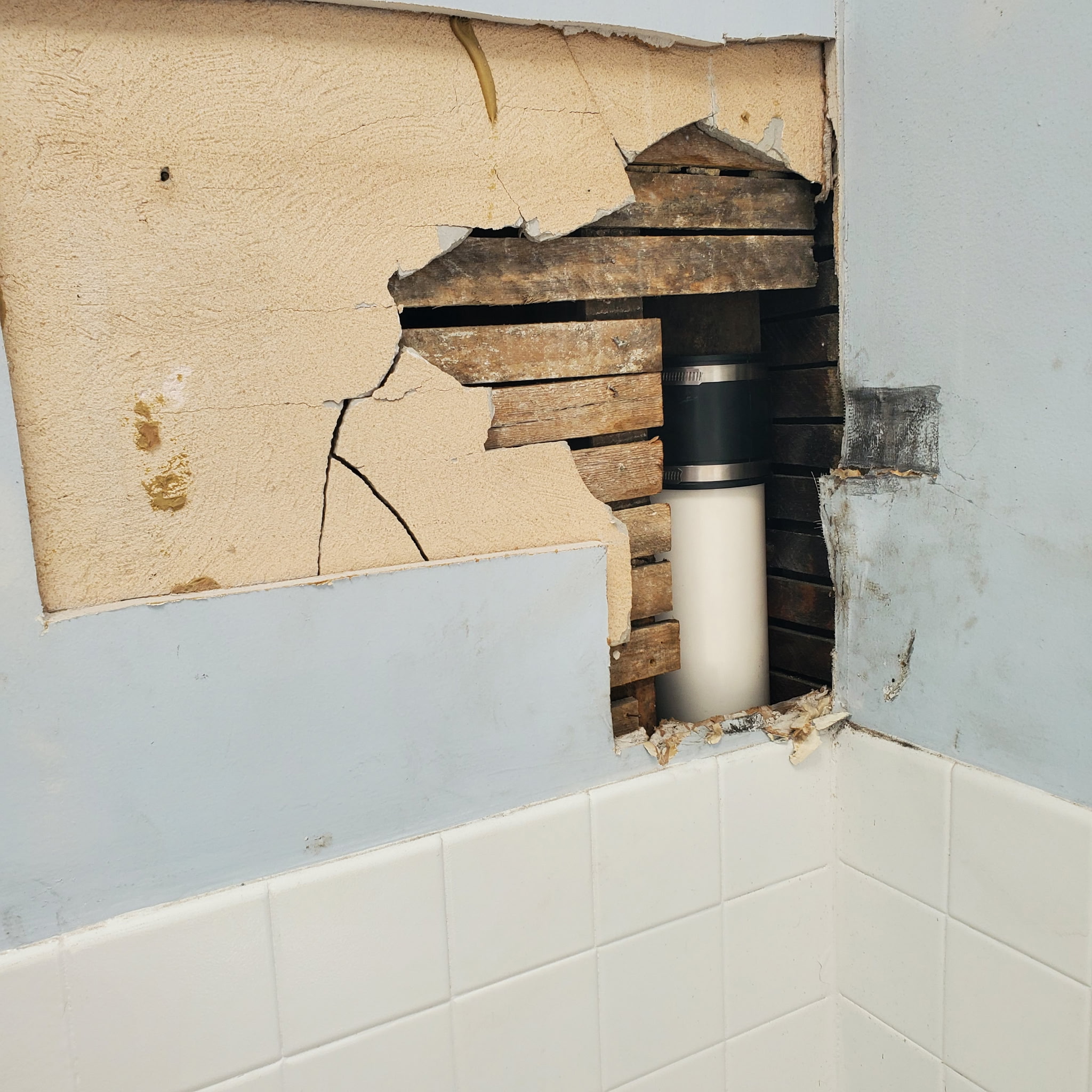 Bathroom plaster repair around plumbing and wood lath in a Philadelphia home | Affordable Philly Painters Bathroom plaster repair around plumbing and wood lath in a Philadelphia home