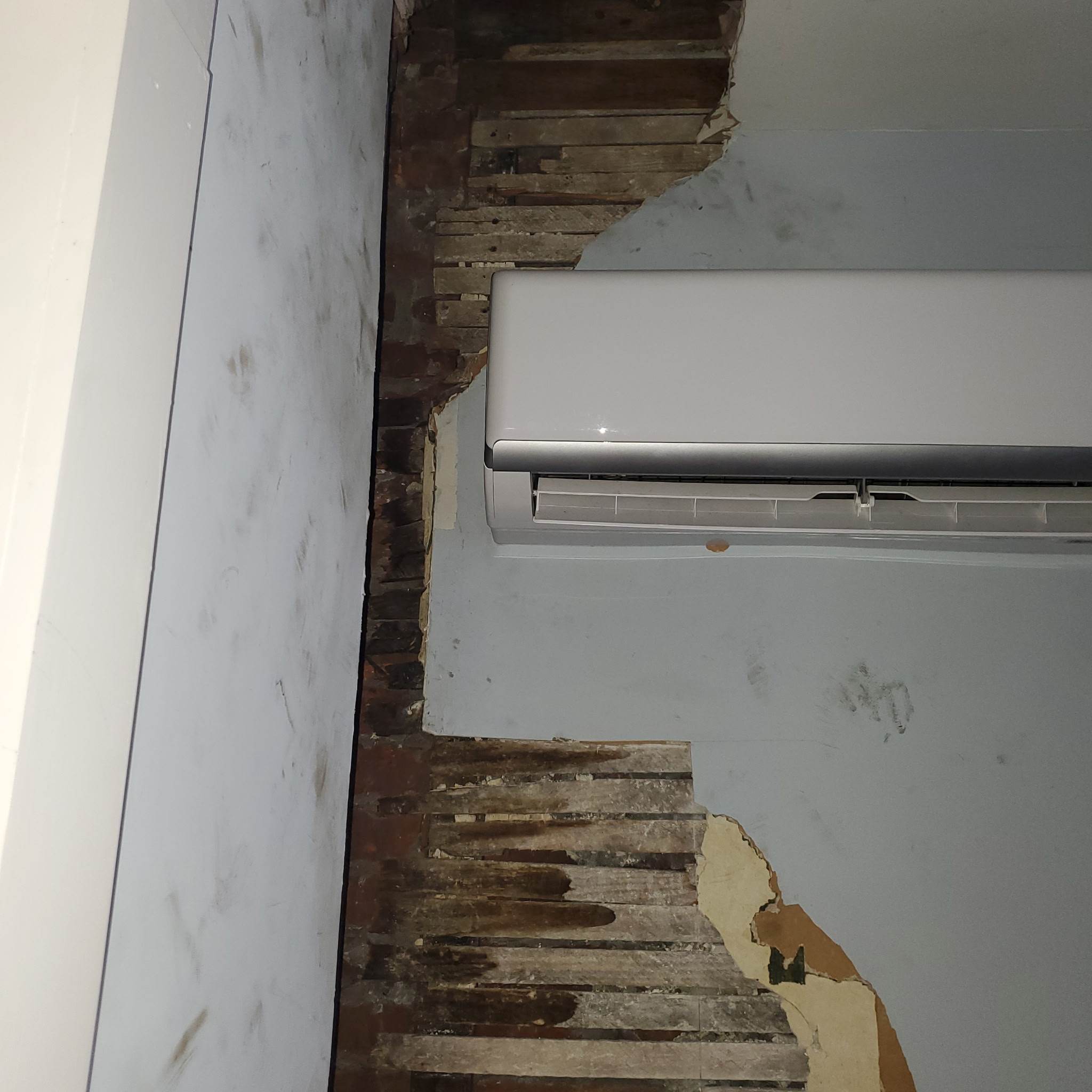 Plaster and wood lath wall repair around a mini split unit in Philadelphia | Affordable Philly Painters Plaster and wood lath wall repair around a mini split unit in Philadelphia