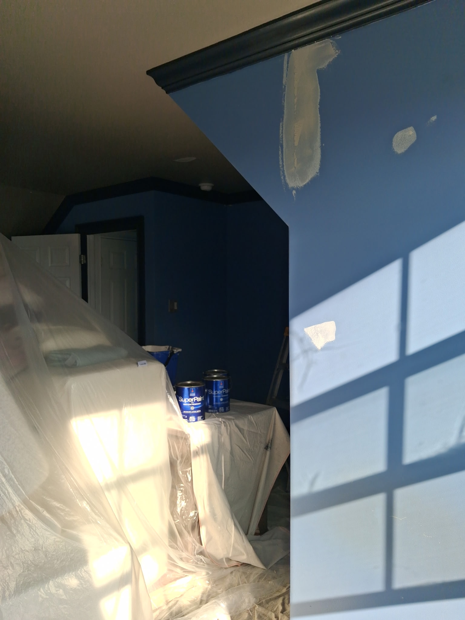 Blue interior room patching and painting with careful surface preparation | Affordable Philly Painters Blue interior room patching and painting with careful surface preparation