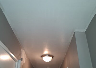 Finished hallway wall and ceiling painting in a Philadelphia home
