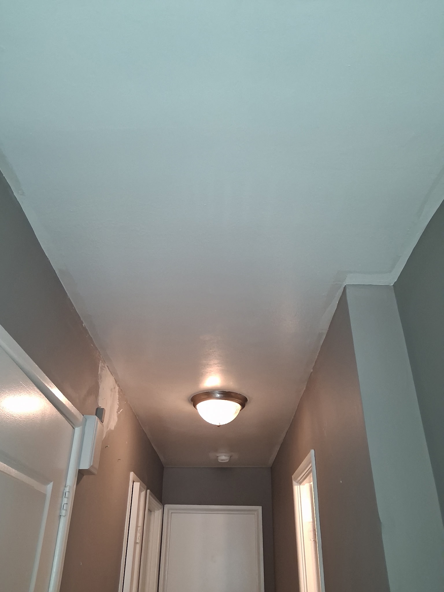 Finished hallway wall and ceiling painting in a Philadelphia home | Affordable Philly Painters Finished hallway wall and ceiling painting in a Philadelphia home