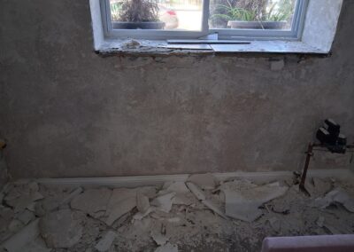 Basement wall prep before painting in Philadelphia - Umar Painting Company