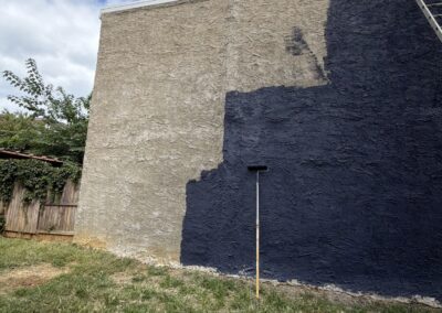 Exterior stucco wall painting in progress in Philadelphia - Umar Painting Company