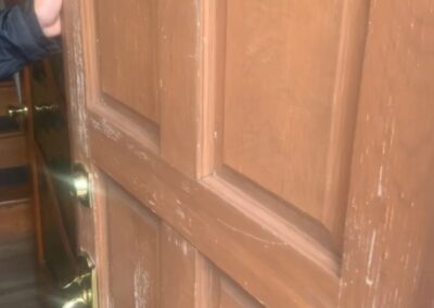 Wood front door before refinishing in Philadelphia - Umar Painting Company