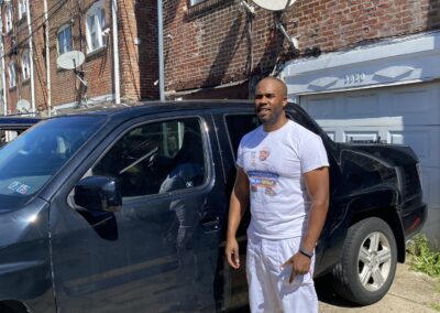 Umar Painting Company owner with work truck in Philadelphia
